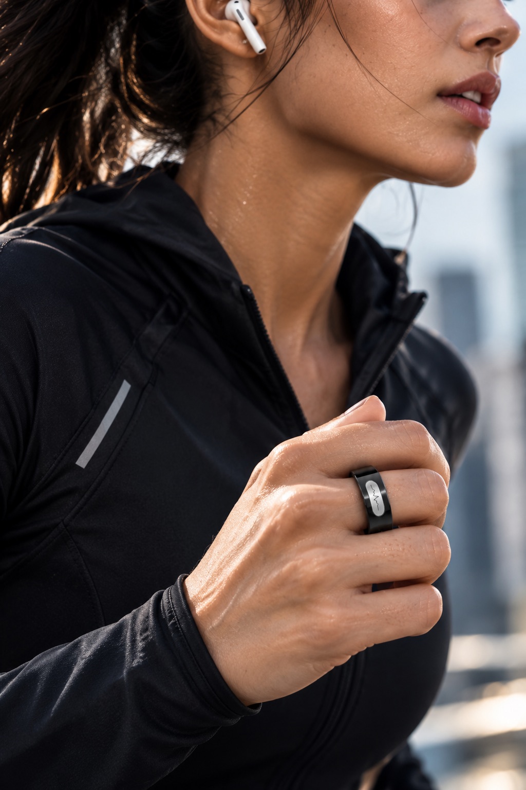 Woman wearing CAERING while running, wireless earbuds in and city skyline behind